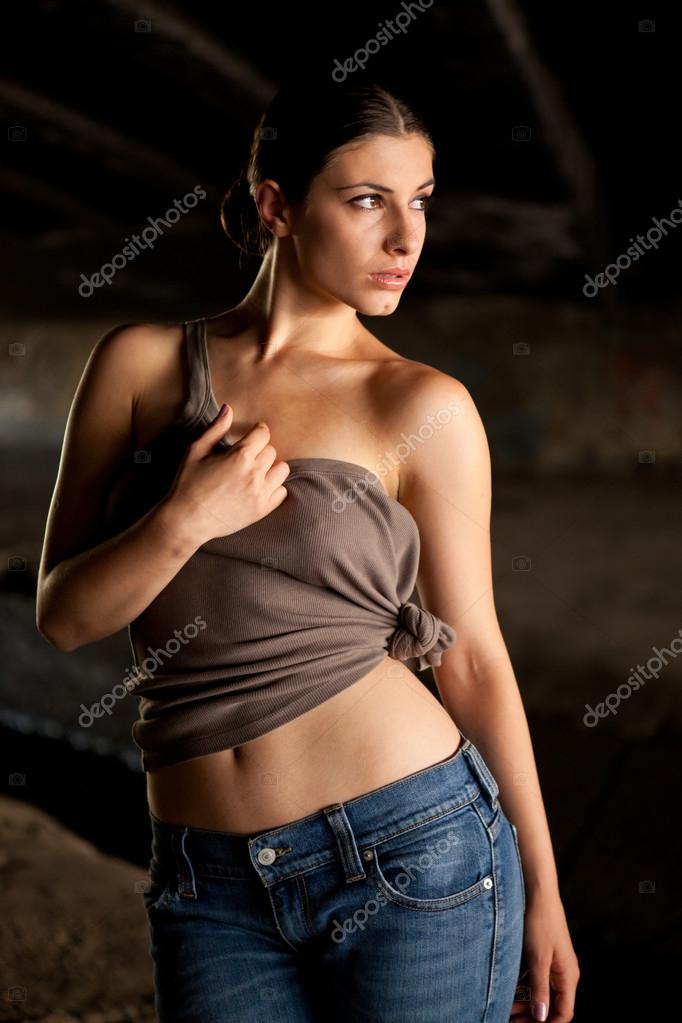 Păianjen web Teorie stabilită Catastrofă  Hot woman with blue jeans and brown top dancing in dark Stock Photo by  ©RVAS 56820093