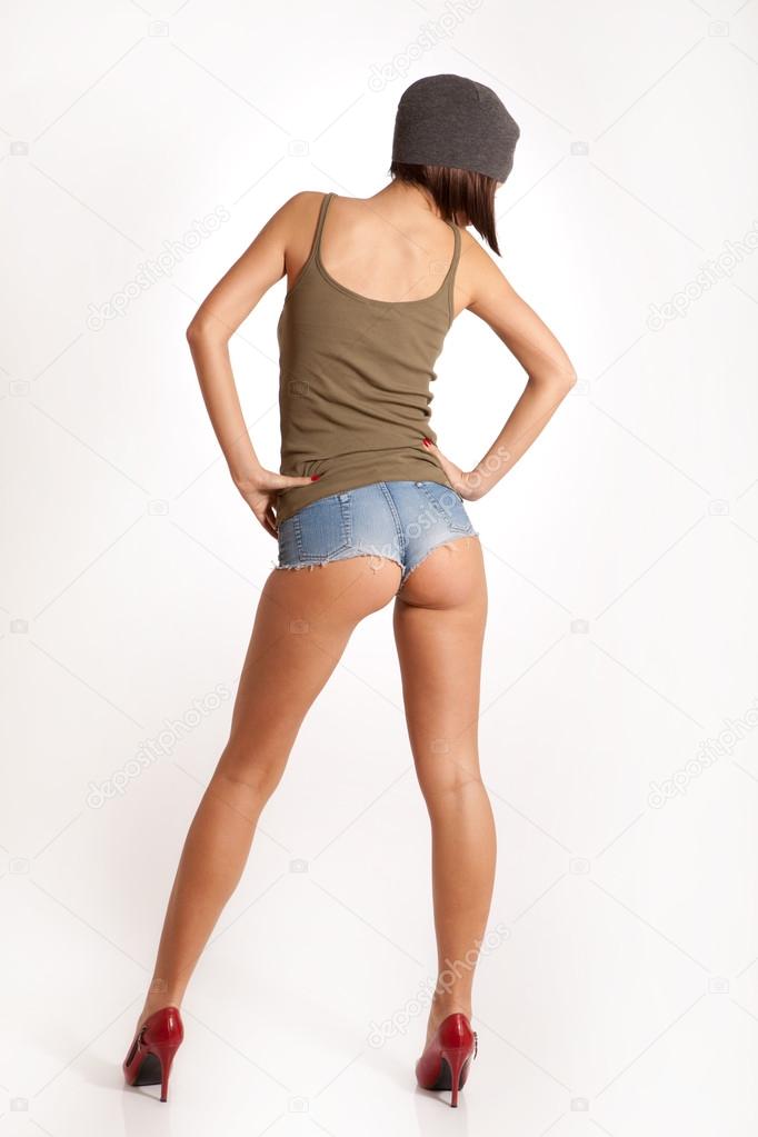 Sexy woman with short jeans, hat and red high Stock Photo ©RVAS 56822773