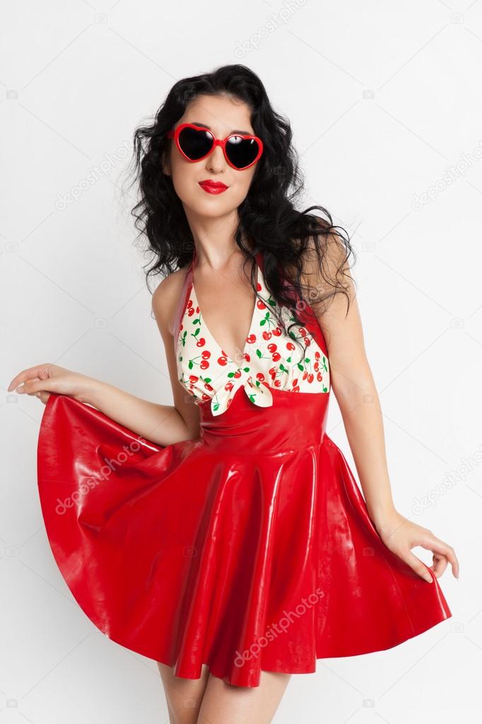 Sexy woman in red latex dress with sunglasses