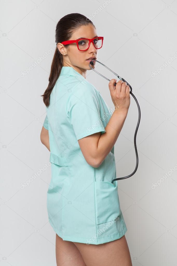 Sexy woman doctor with a stethoscope and red glasses Stock Photo by ©RVAS 83317282 image