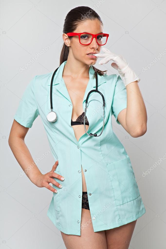 Sexy woman doctor with a stethoscope and red glasses Stock Photo by ©RVAS 83317340