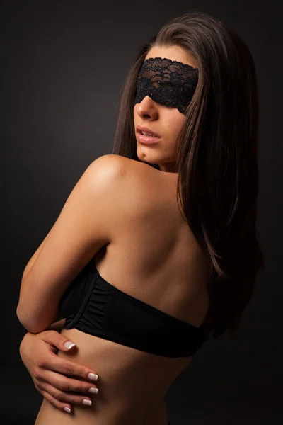 Beautiful sexy woman with black lingerie and blindfold — Stock Photo, Image