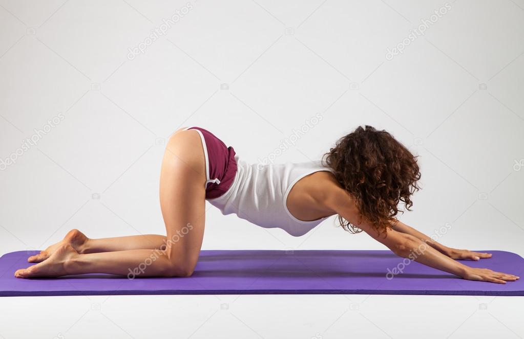 Young Sexy Attractive Fit Woman At Gym Doing Yoga Exercise And Position  Sitting On Mat In Meditation And Relax After Training Workout Isolated On  White Background Stock Photo, Picture and Royalty Free