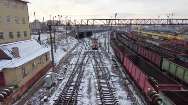 Railway tracks with freight trains, a locomotive — Stock Video