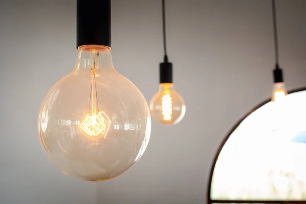 vintage light bulb hanging from ceiling, lighting decoration