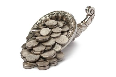 Silver coins pour out from the silver cornucopia. Isolated over white background. Half-turn view. clipart