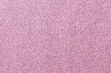 Pembe kumaş, bukle, kabarık yüzey. Yakın plan..