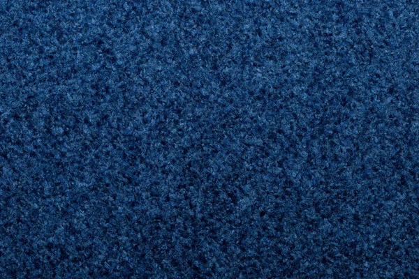 The texture of the furniture, upholstery fabric of blue color close-up.