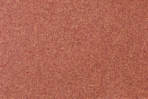 Red rough textile texture, canvas background. Matting.