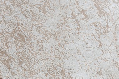 Arka plan ve tasarım için soyut desenli sahte süetin bej dokusu.