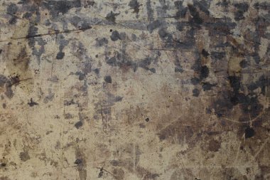 Bej kartonun yüzeyinde koyu kahverengi lekeler var. Yaratıcılık için doku.