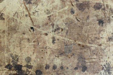 Liflerin yüzeyinde koyu lekeler, lekeler ve çizgiler var. Grunge dokusu.