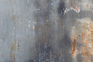 Paslı metal bir yüzeyde eski gri boya. Grunge dokusu. Yaratıcılık için doku.
