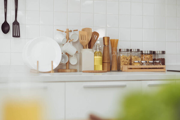 Kitchen accessories, kitchen wood utensils in white kitchen room, ss