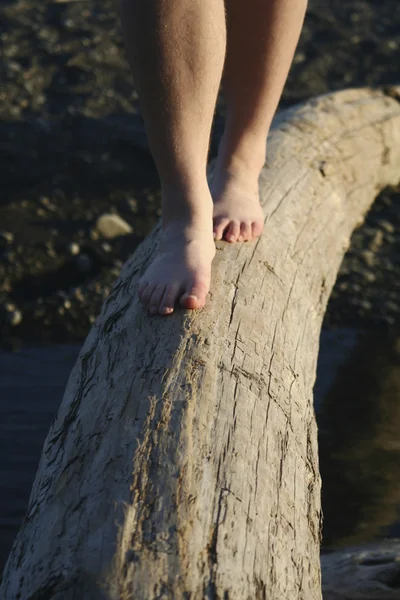 Feet on a log bridge — Stock Photo, Image