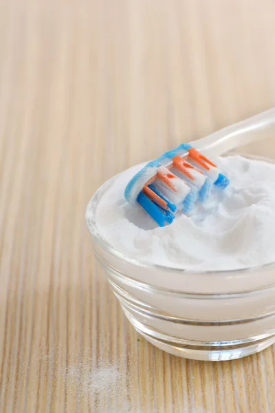 Sodium bicarbonate  and a toothbrush — Stock Photo, Image