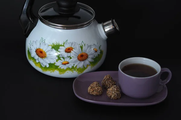 Beautiful enamelled kettle with a whistle on a black background. — Stock Photo, Image