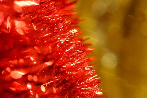 Christmas or new year background made of red and yellow tinsel — Stock Photo, Image