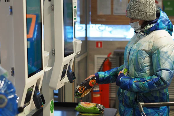 Online shopping. A woman pays for goods at the online checkout.