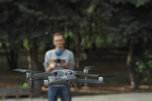 Drone pilot. Controlling the drone in the open air.