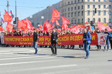 People with red banners and flags.