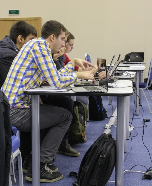 Young people sitting at a computer