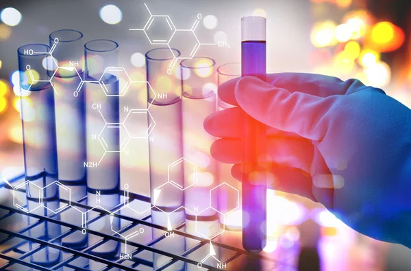 Double exposure of scientist hand holding laboratory test tube — Stock Photo, Image