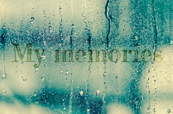 Natural water drops on glass window with word "My memories" — Stock Photo, Image