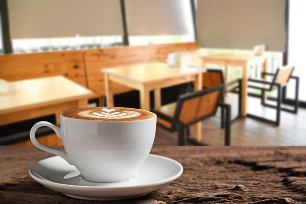 White coffee cup on wooden table — Stock Photo, Image