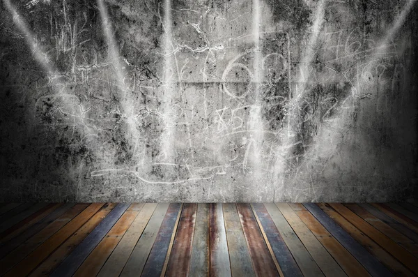 Light in dark room with colorful wooden floor and grunge stone w — Stock Photo, Image