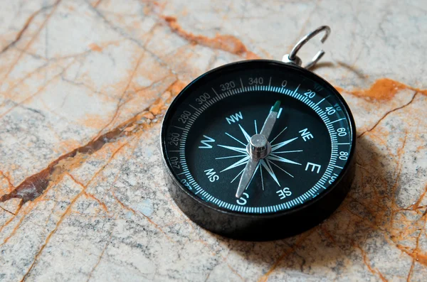 Compass on marble stone background — Stock Photo, Image