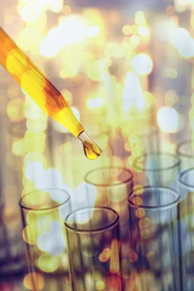 double exposure of science laboratory test tubes with bokeh