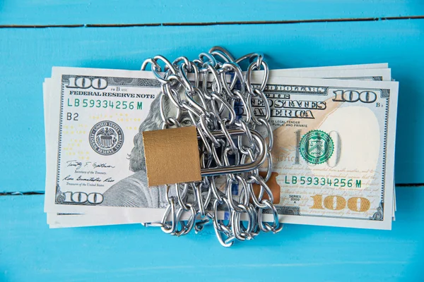 Locked dollar money by metal chain link with padlock — Stock Photo, Image