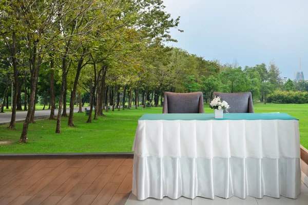 Reception counter with green park background — Stock Photo, Image