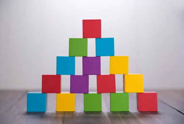 Colorful stack of wood cube building blocks