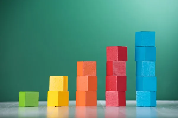 Colorful stack of wood cube building blocks — Stock Photo, Image
