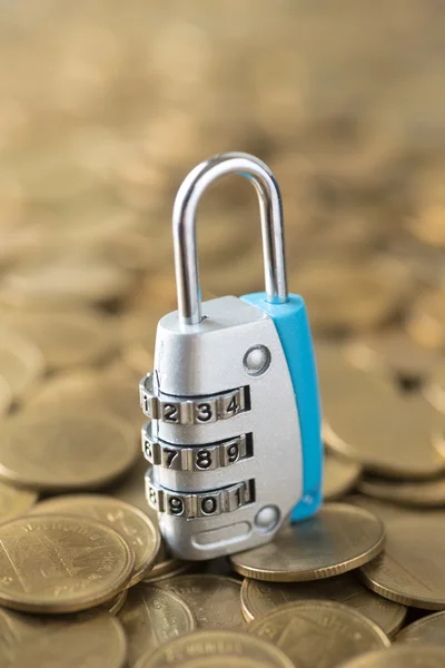 Padlock key on gold coins — Stock Photo, Image