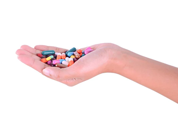 Pílulas na mão isolado no fundo branco — Fotografia de Stock