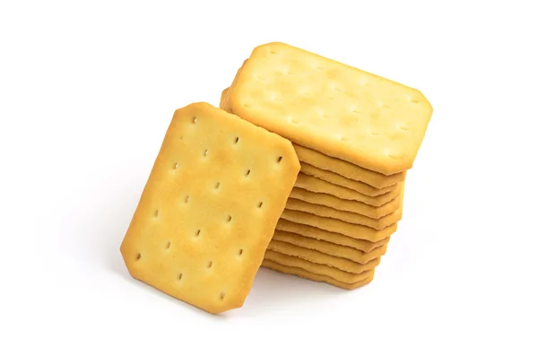 Galletas saladas en forma cuadrada sobre fondo blanco —  Fotos de Stock