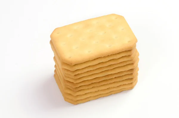 Galletas saladas en forma cuadrada sobre fondo blanco —  Fotos de Stock