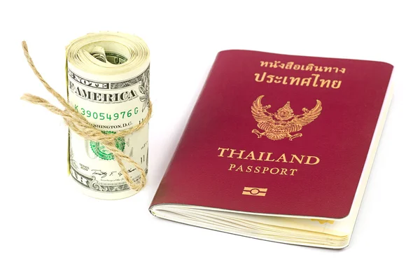 Thailand passport and roll of dollars money on white background — Stock Photo, Image