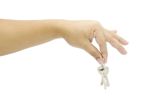 Hand holding a key on a white background — Stock Photo, Image