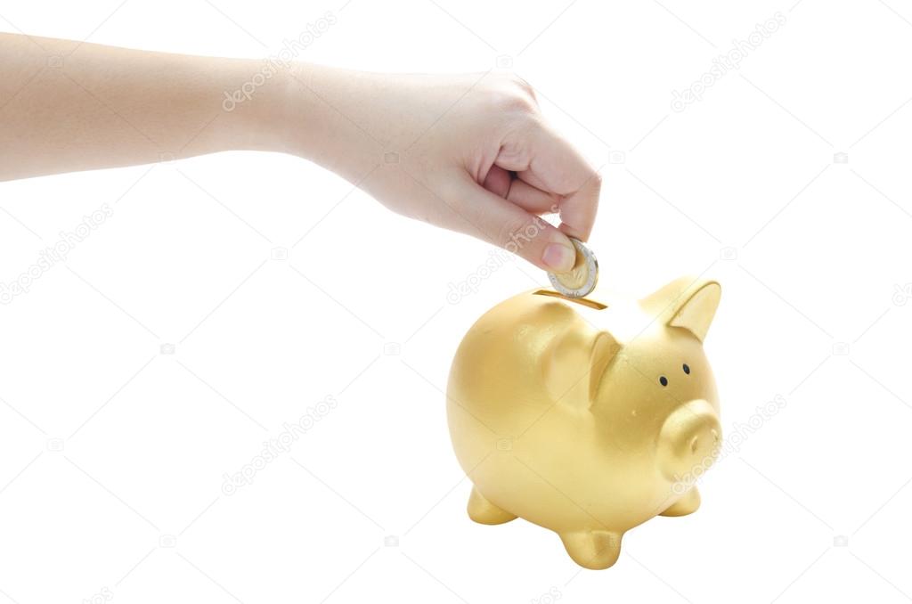 woman hand dropping a coin into a piggy bank isolated on whiteba