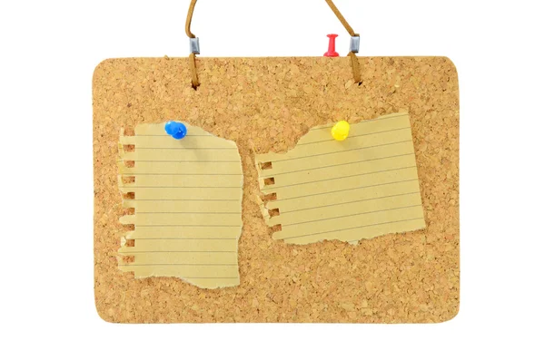 Cork board with color pins and blank note — Stock Photo, Image