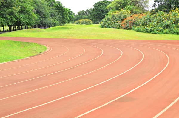 Faixa de corrida cor vermelha padrão de borracha — Fotografia de Stock