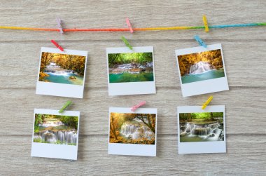 şelale fotoğrafları clothespins ile ahşap arka plan asılı