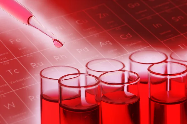 Red laboratory test tubes — Stock Photo, Image