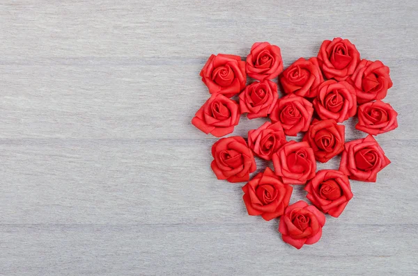 Red heart shape on wood background — Stock Photo, Image