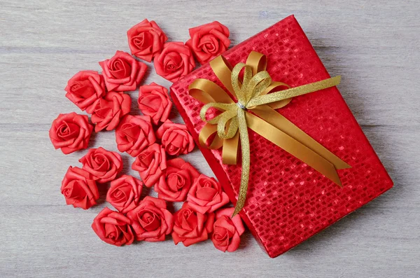 Red gift box on wood background — Stock Photo, Image