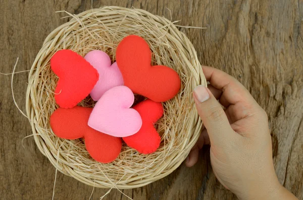 Hand pick up a group of heart shape — Stock Photo, Image